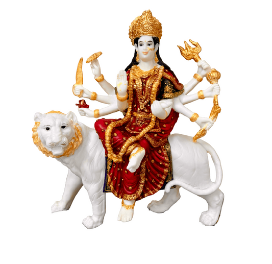 Statue of a deity on a white tiger with gold and red details, placed on a wooden surface.