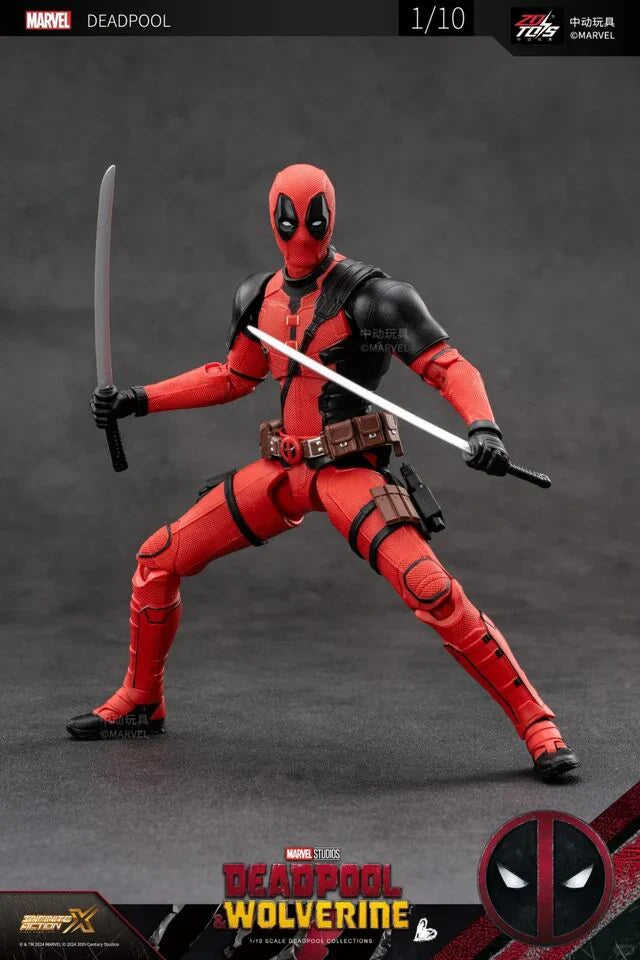 Deadpool action figure in red and black costume with weapons on a gray background