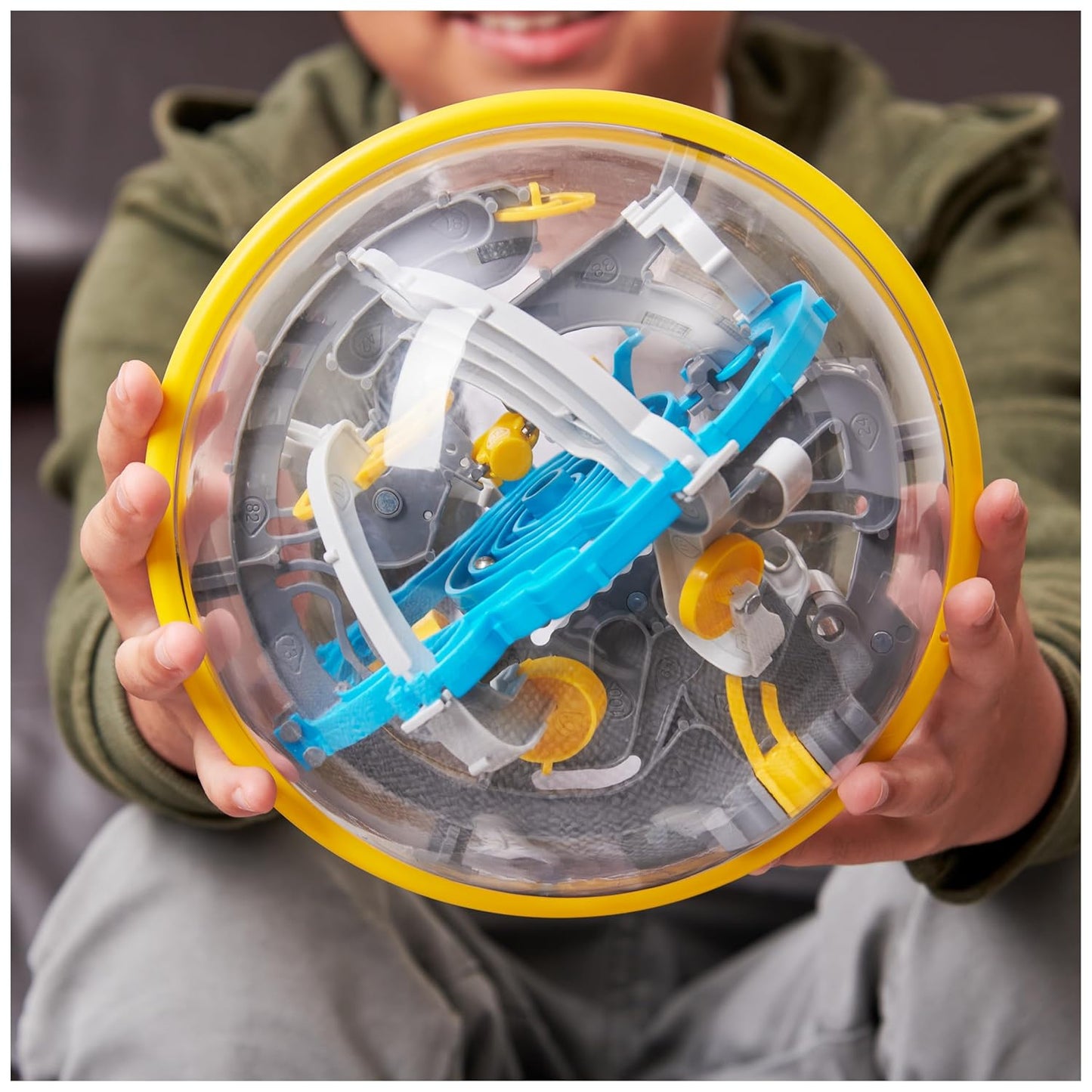 "Child playing with PERPLEXUS Beast 3D Maze Game – Screen-Free Puzzle Toy"