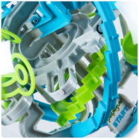 Close-up of a toy marble run with blue, gray, and green colors on a white background.