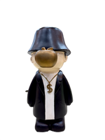 Front view of 9.5 inch resin showpiece in black coat with golden apple face and dollar chain, modern art figurine for home décor