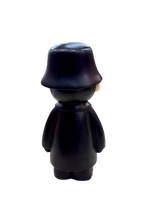 Back view of 9.5 inch resin showpiece figurine in glossy black coat and hat, modern art collectible for home and office décor