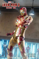 Iron Man toy figure from Iron Man 3 with glowing eyes in a dynamic pose.