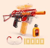 Red and orange toy gun with yellow beads, safety goggles, and a bottle of gel on a beige background.