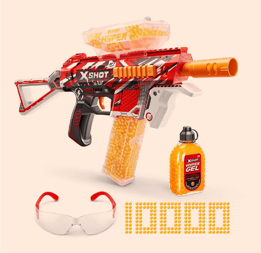 Red and orange toy gun with yellow beads, safety goggles, and a bottle of gel on a beige background.