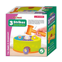 Toddler girl playing with colourful hammer ball bench toy with animal face balls