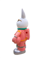 Left side angle of Astronaut Bunny figurine with helmet and space suit details