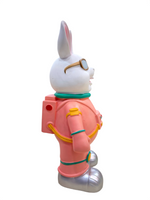 Right side view of Astronaut Bunny 13.3-inch collectible holding helmet