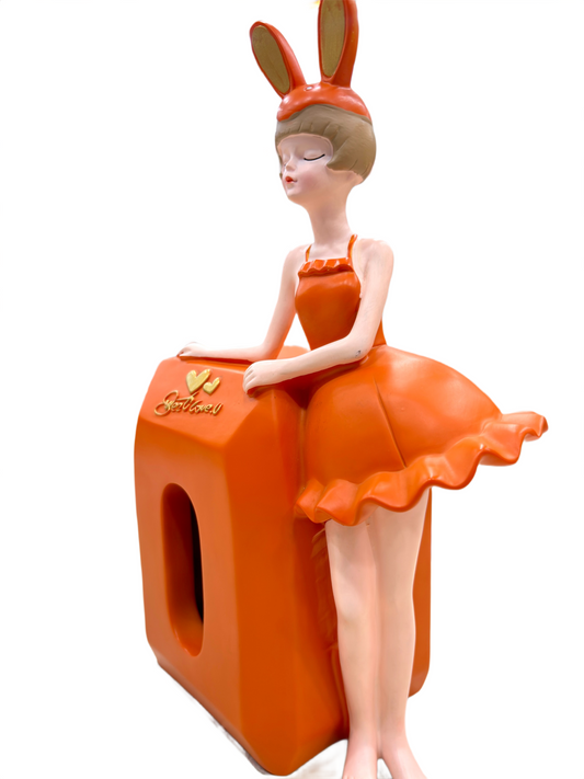 side view of Bunny Girl 12-inch figurine leaning on orange seat