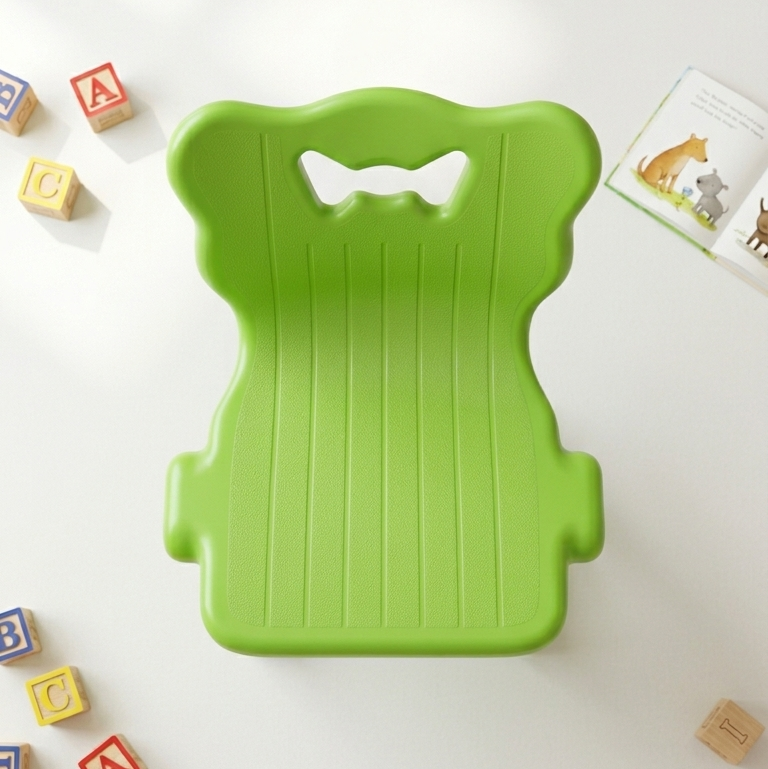 Children's lime green plastic chair with butterfly handle cutout and ribbed seat