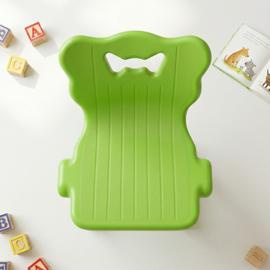 Children's lime green plastic chair with butterfly handle cutout and ribbed seat
