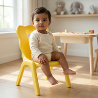 Children's sunshine yellow plastic chair with butterfly handle cutout and ribbed seat