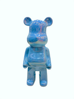 Close-up of glossy blue ceramic bear piggy bank showpiece with premium finish.