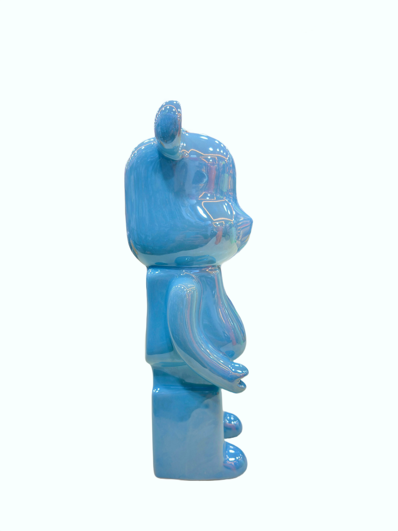 Glossy blue ceramic bear piggy bank showpiece displayed as home décor.