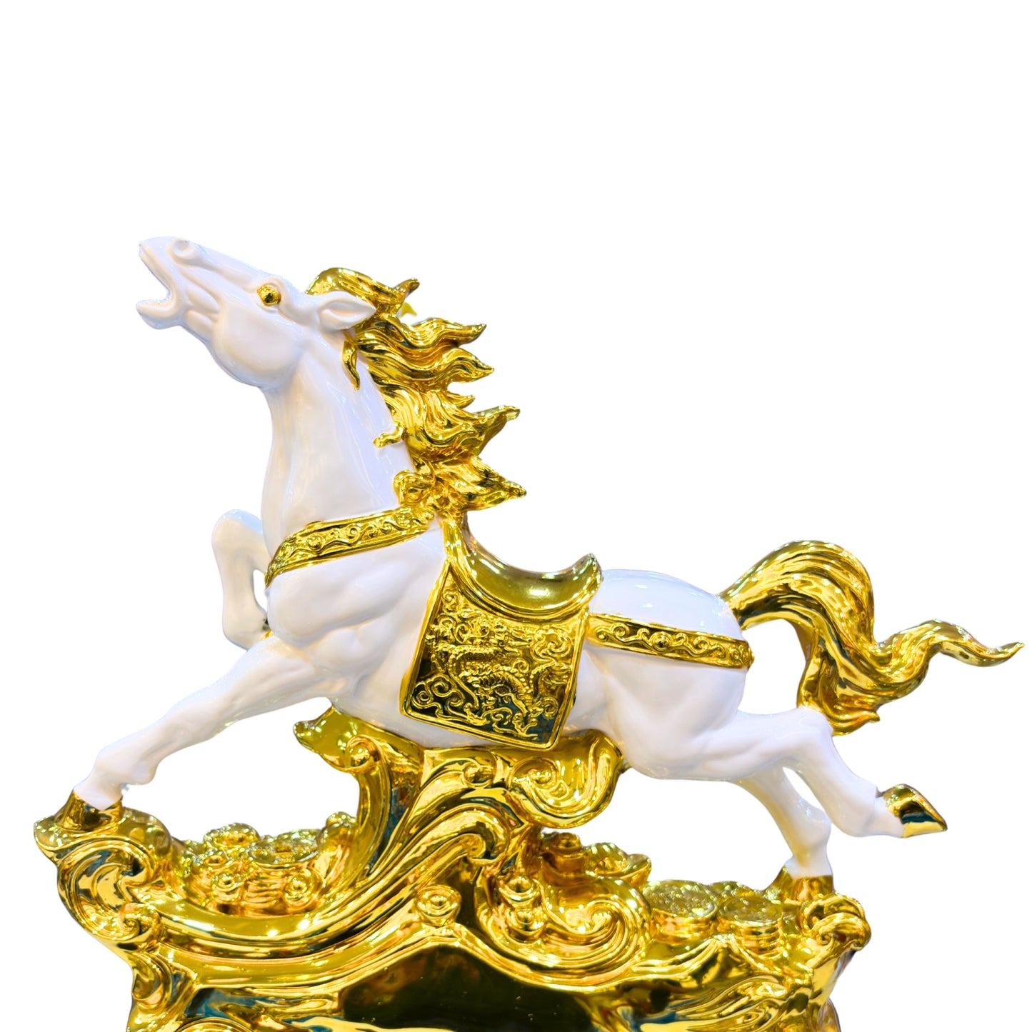 Close-up of detailed handcrafted golden horse sculpture with glossy finish