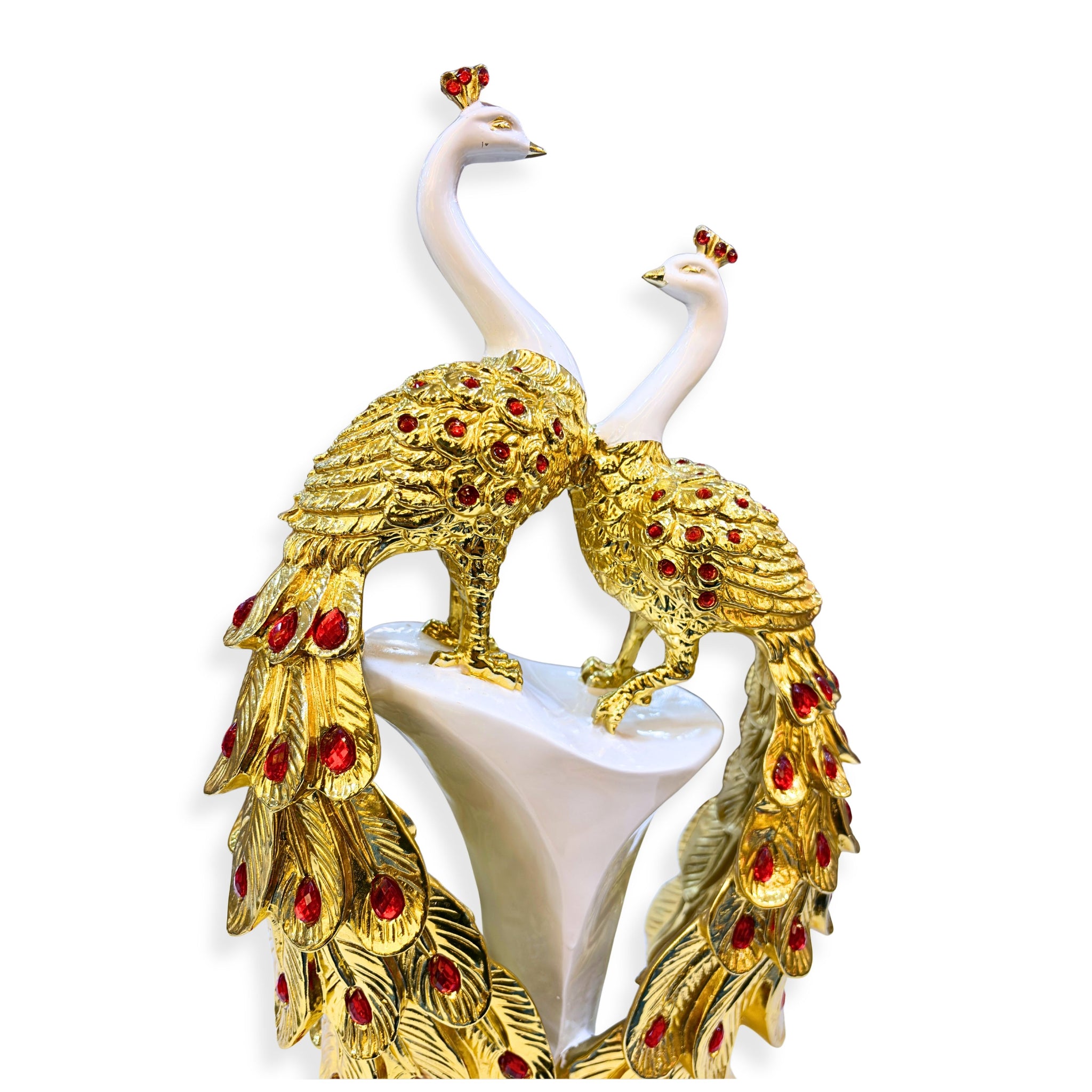 Close-up of handcrafted golden peacock feathers with red embellishments – detailed artistic polystone décor statue