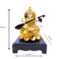 Handcrafted Goddess Saraswati Idol in Gold Finish Resin Sitting on Lotus with Veena – 26.6 cm Decorative Statue for Home & Office