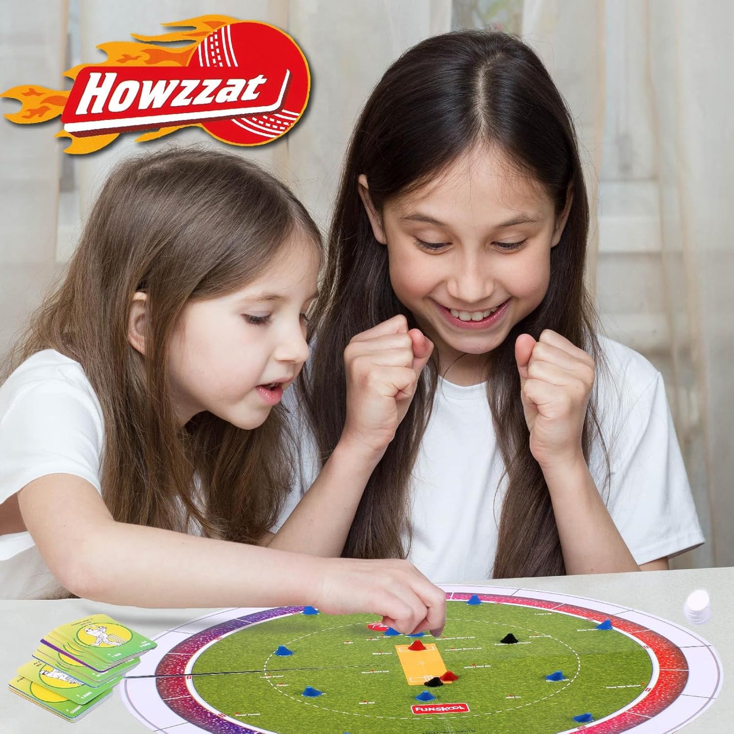 Kids playing Funskool Howzzat tabletop cricket game