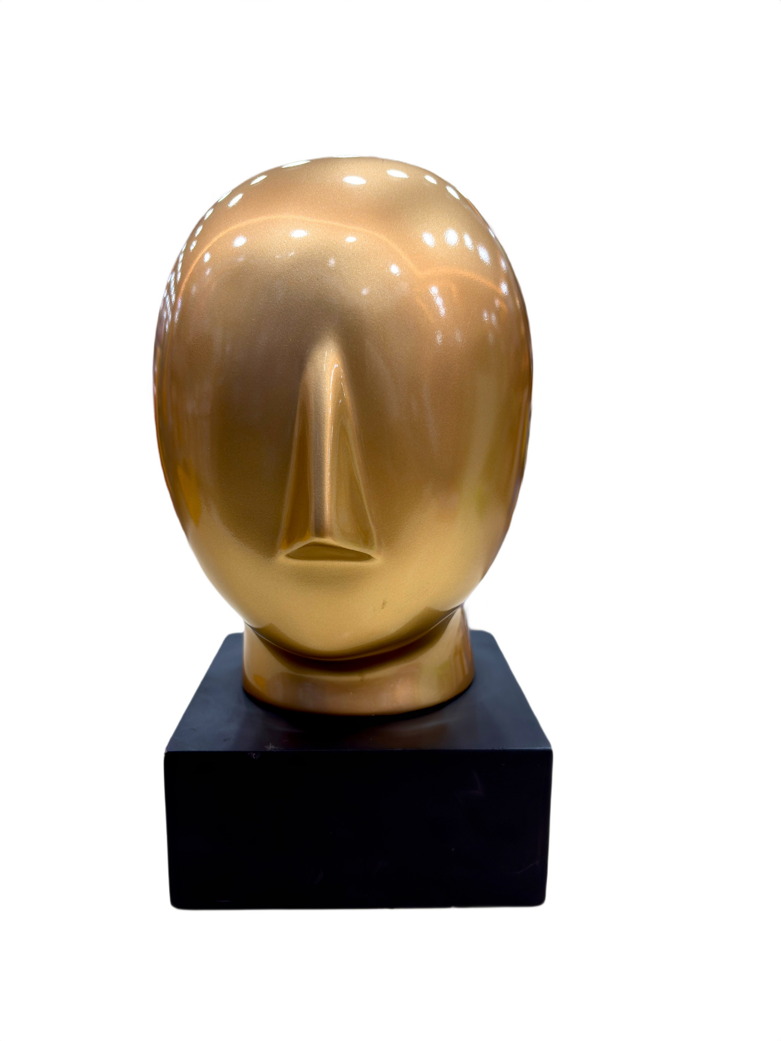Close-up of Golden Abstract Face sculpture with modern abstract detailing