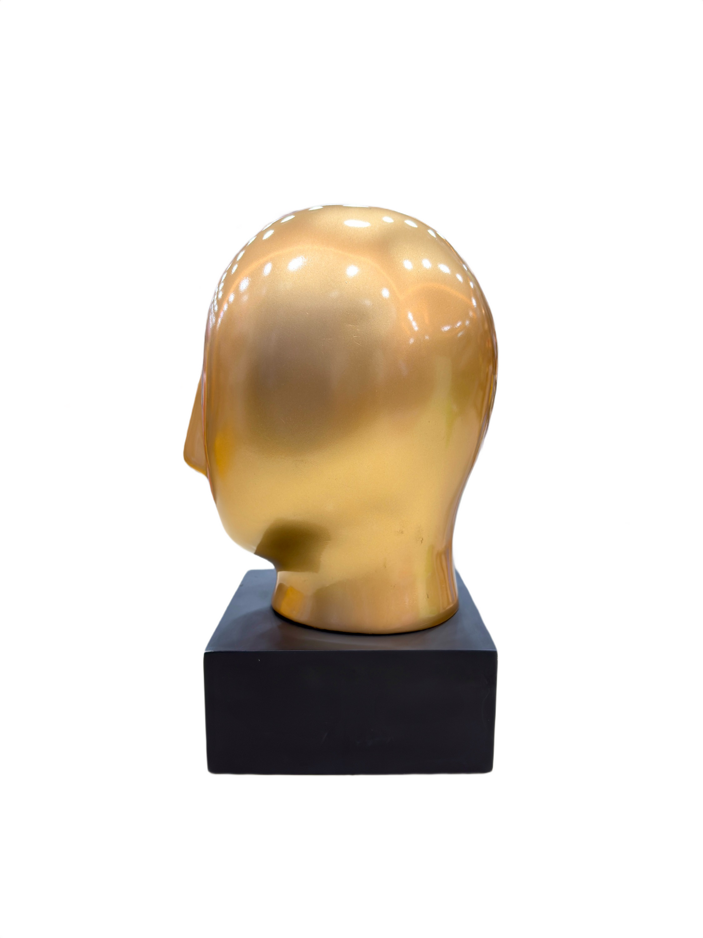 Left side angle of Golden Abstract Face sculpture with sleek golden finish