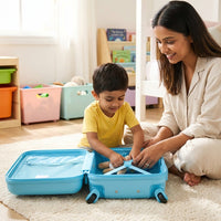 Open clamshell kids cabin bag with sky blue interior and integrated luggage restraint strap system