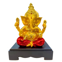Golden and red Lord Ganesha resin idol – handcrafted Hindu god statue for home temple décor and gifting.