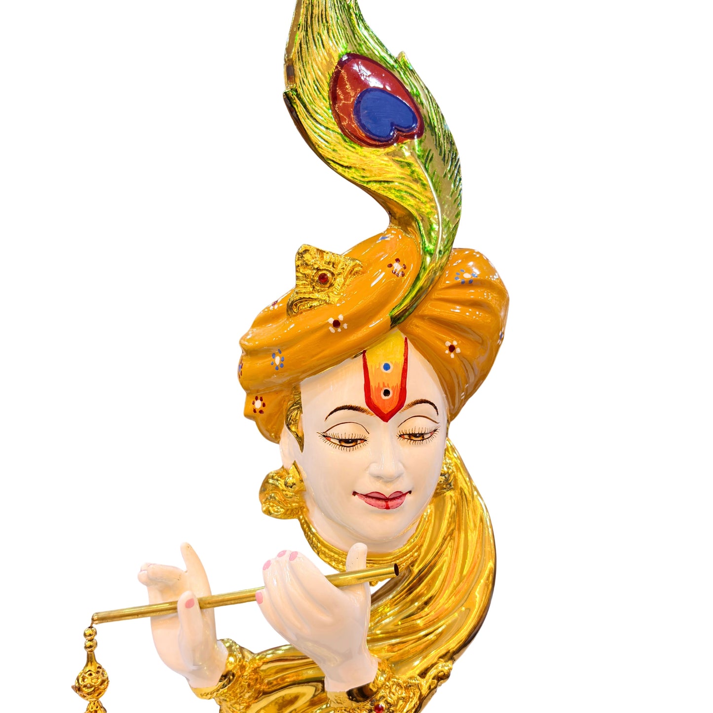Close-up of Lord Krishna’s face and flute with golden detailing and peacock feather accent.