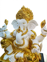 Decorative statue of a deity with gold and white colors on a white background