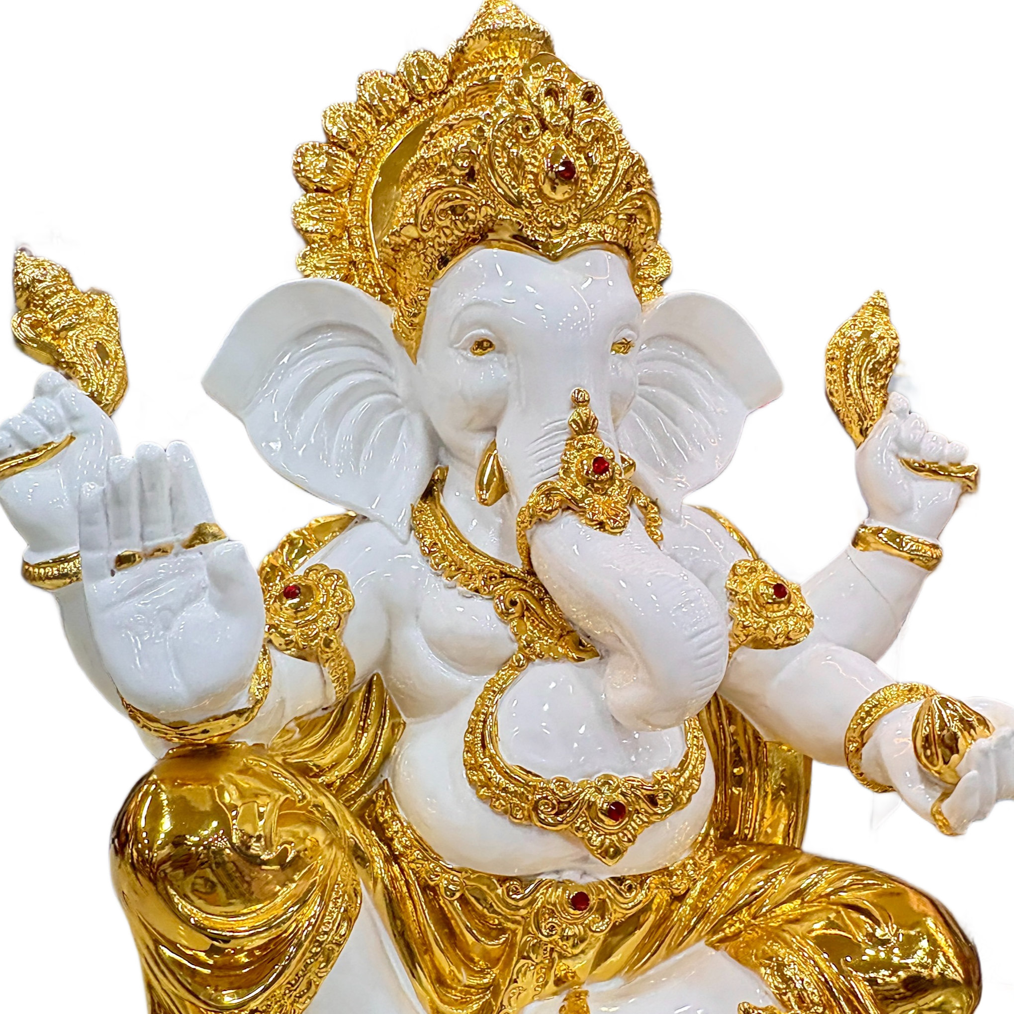 Statue of a deity in white and gold on a clear base