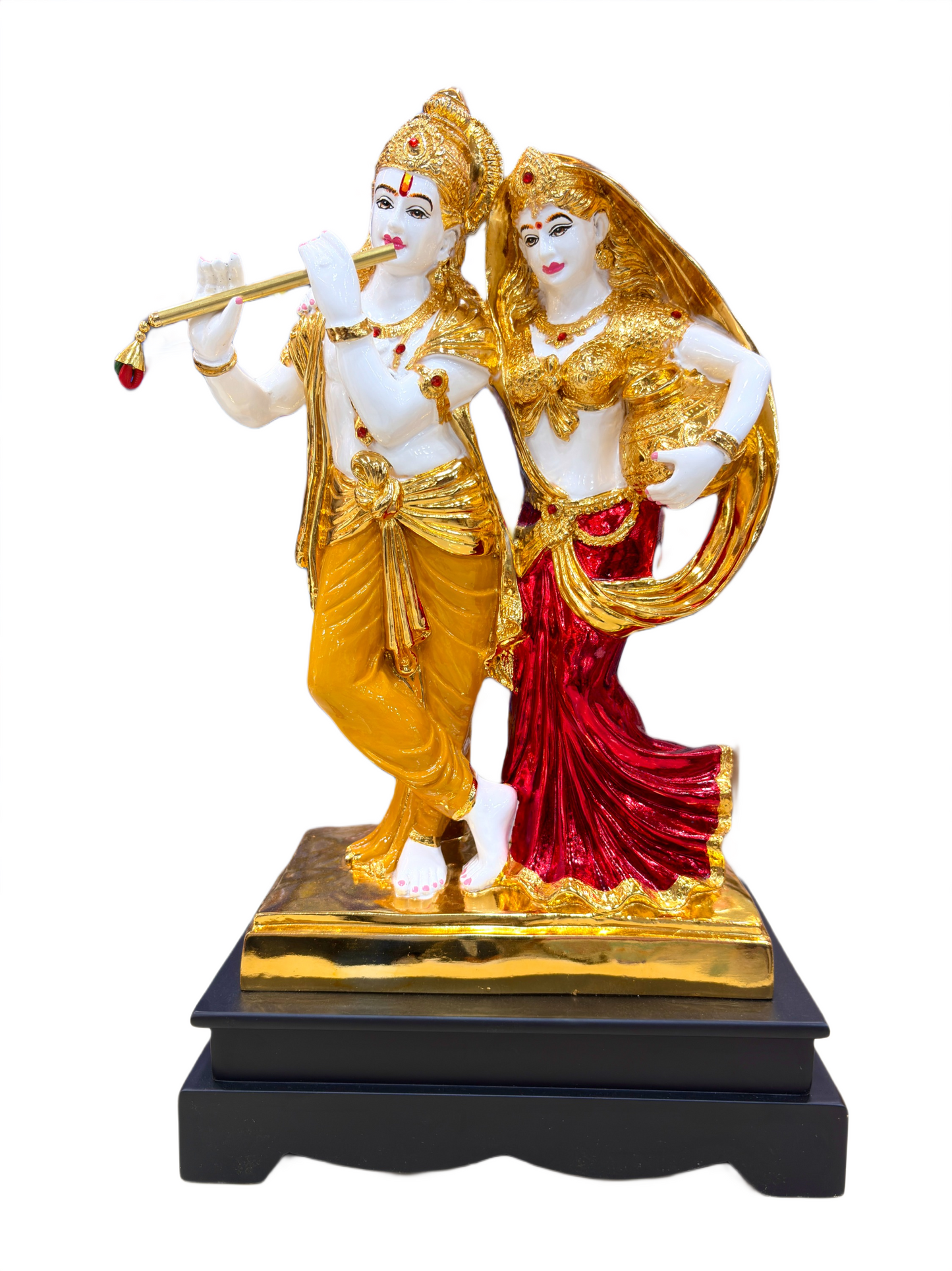Radha Krishna idol with flute and wooden base placed in home décor setting spiritual resin statue for vastu and puja room

