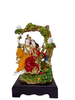 Radha Krishna swing idol decorative showpiece displayed in home décor setting