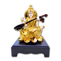 Handcrafted Goddess Saraswati Idol in Gold Finish Resin Sitting on Lotus with Veena – 26.6 cm Decorative Statue for Home & Office