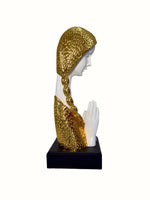 White poly stone welcoming women pillar showpiece with intricate golden accents and smooth finish